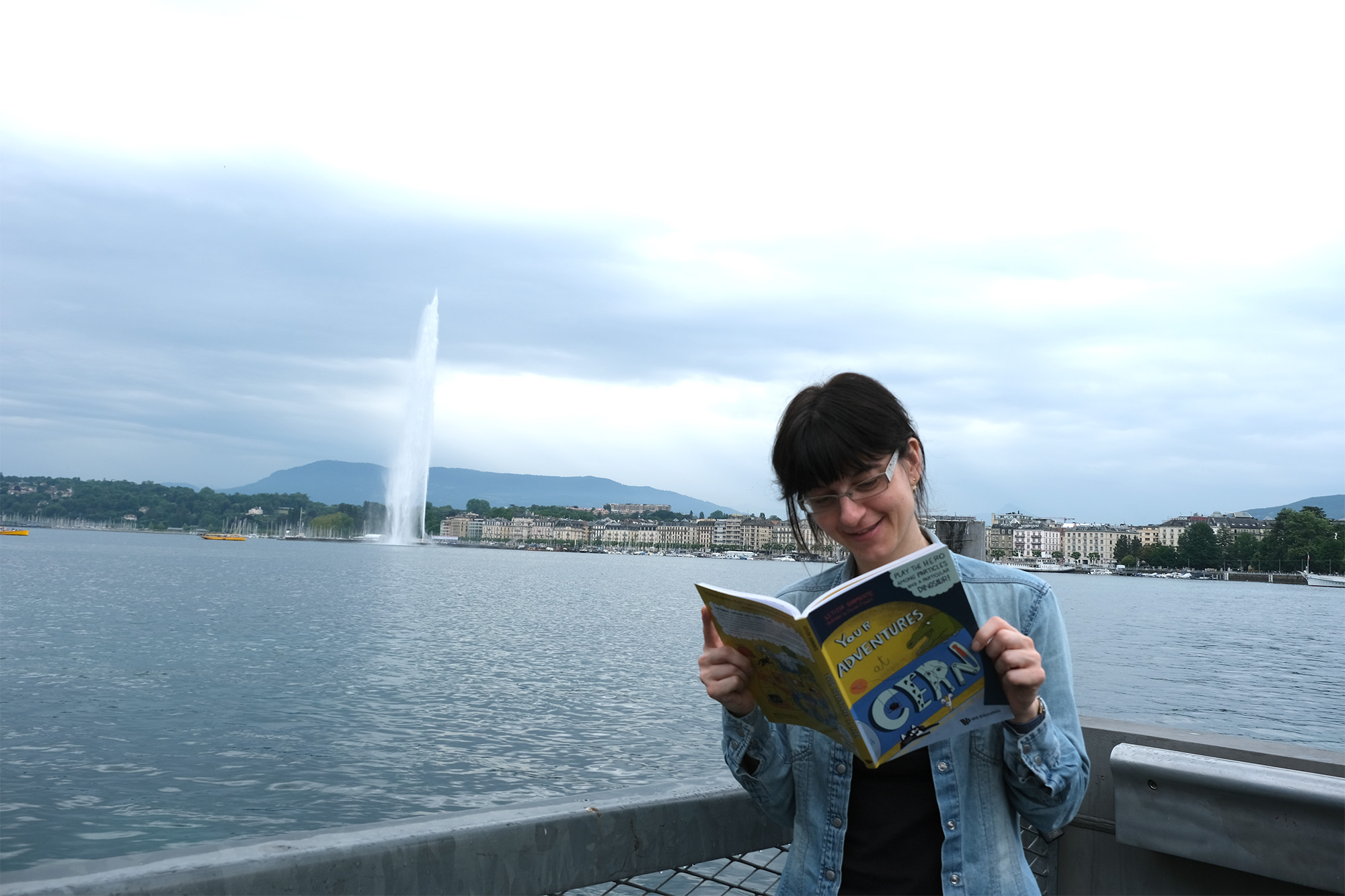 the author of Your Adventures at CERN and other science books for children, Letizia Diamante, in front of the jet d'eau in Geneva, Switzerland